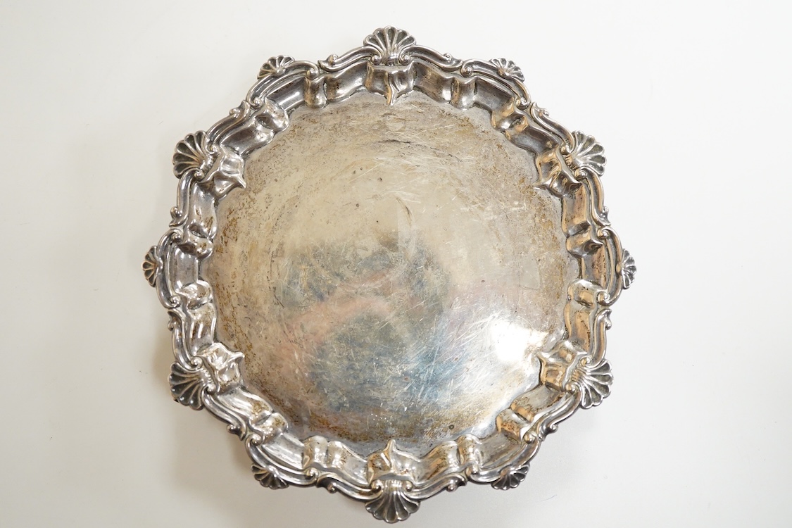 A George V silver waiter, by Barker Brothers, Chester, 1911, with shell and scroll border, on three scroll feet, 15.7cm, 4.5oz.